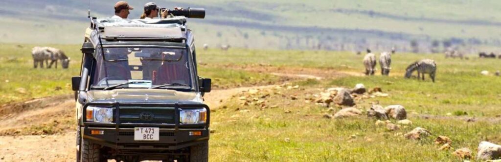 Safari Vehicle over looking Zebras on a Tanzania Safari