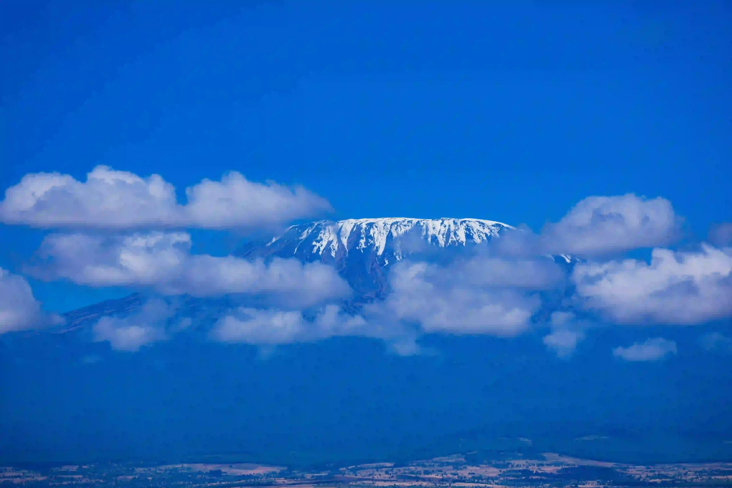 Northern side views of Kilimanjaro and open plains toward the Kenya border