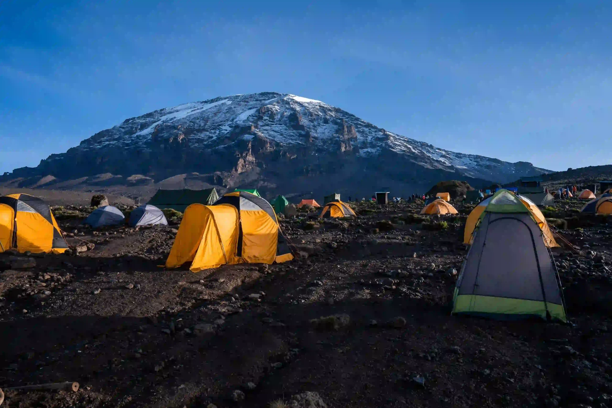 Camping on Kilimanjaro with high altitude landscape and tents