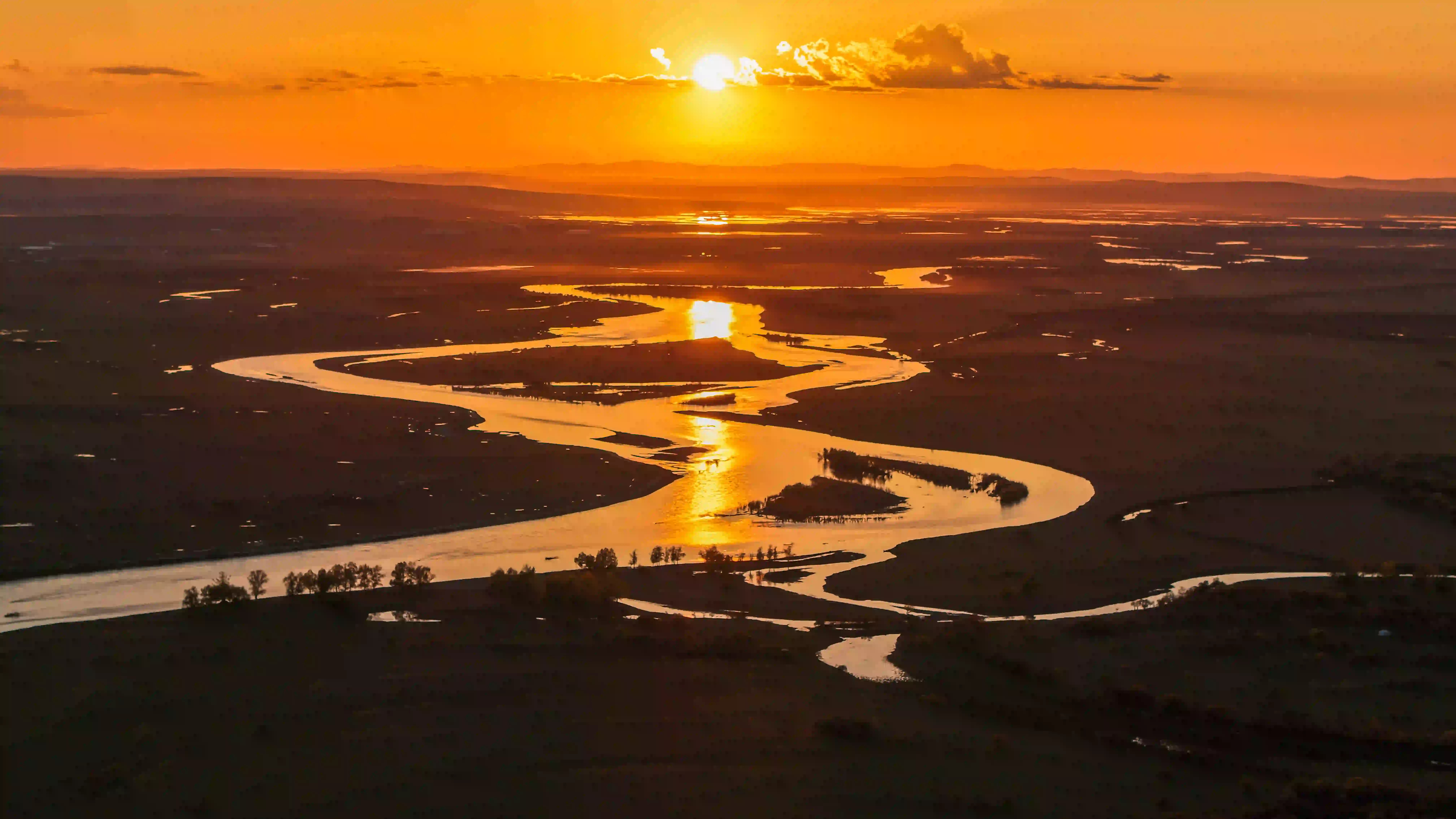 Scenic Serengeti river landscape at sunset showing why fly-in Tanzania safaris cost more