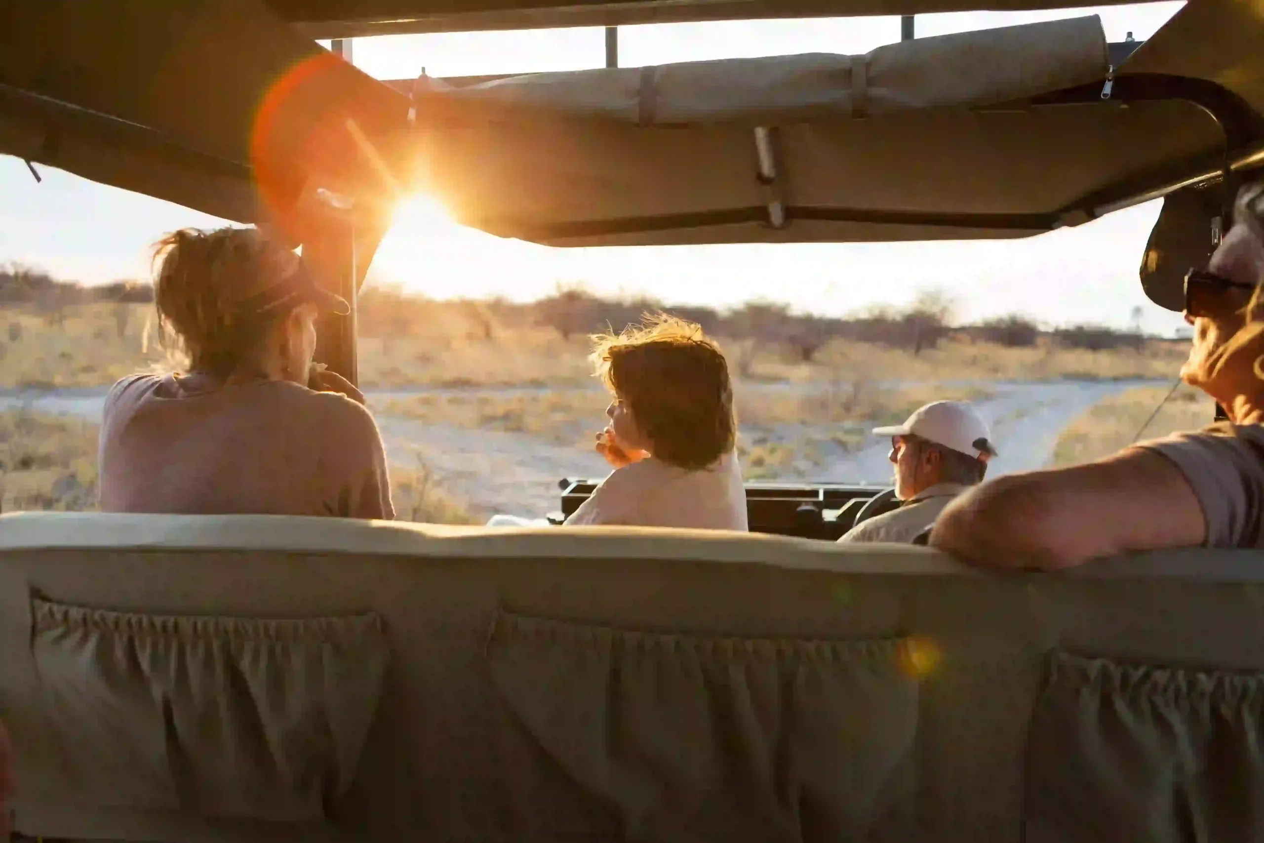 Family enjoying a private safari in an open vehicle
