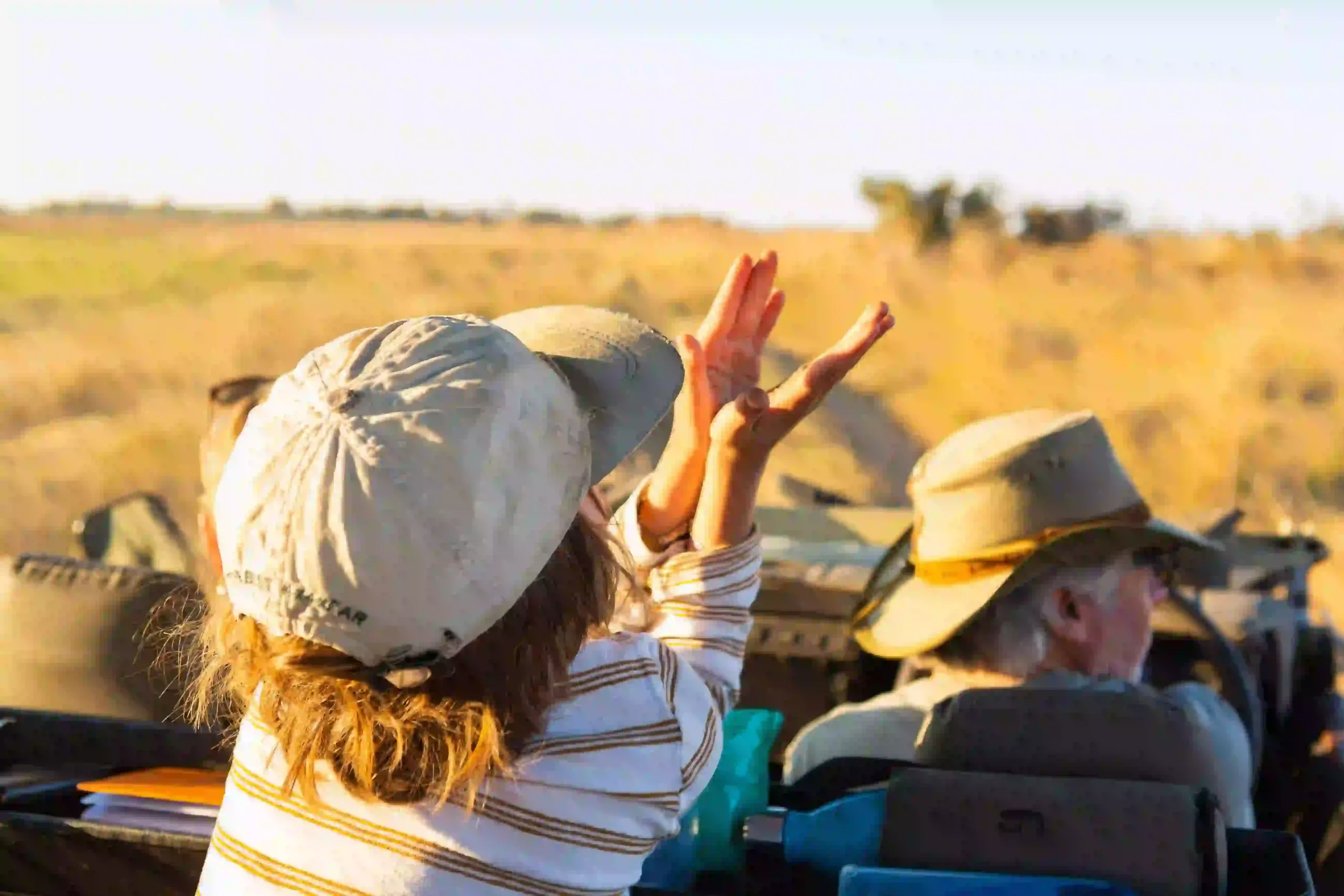Child enjoying sunrise safari from a private vehicle
